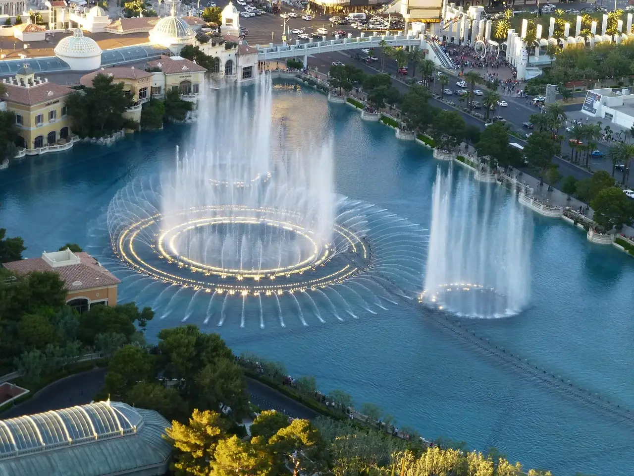 The Bellagio fountains in Las Vegas seen from above, water jets rising from the lake