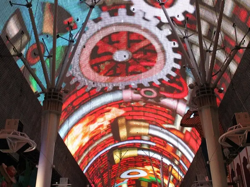 The Fremont Street Experience LED canopy glowing red and white over the downtown street and its columns