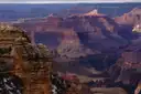 The Grand Canyon from the South Rim, with a rocky outcrop in front of layered red canyon walls