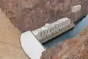 The Hoover Dam power plant at the foot of the dam wall, seen from above next to the river