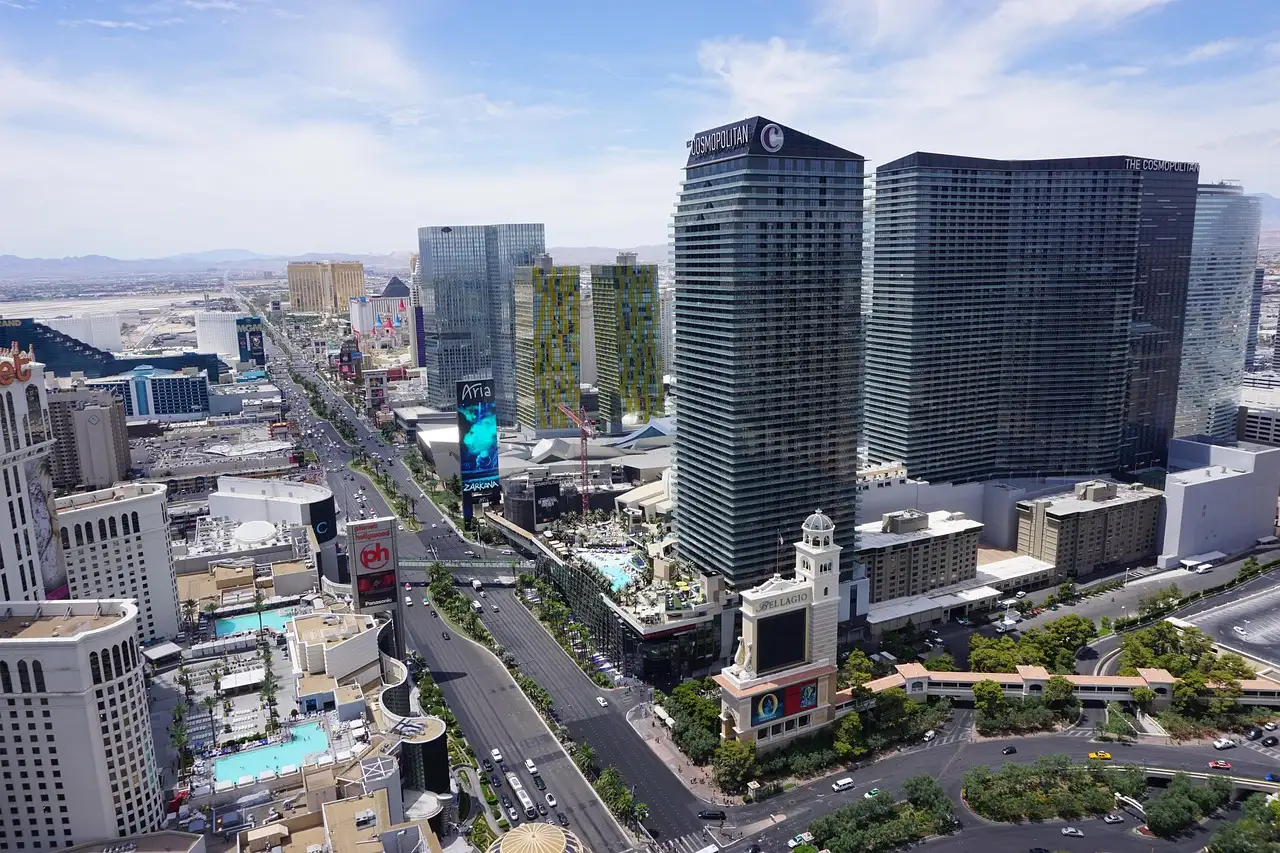 The Las Vegas Strip seen from above in daylight, resort towers along the boulevard