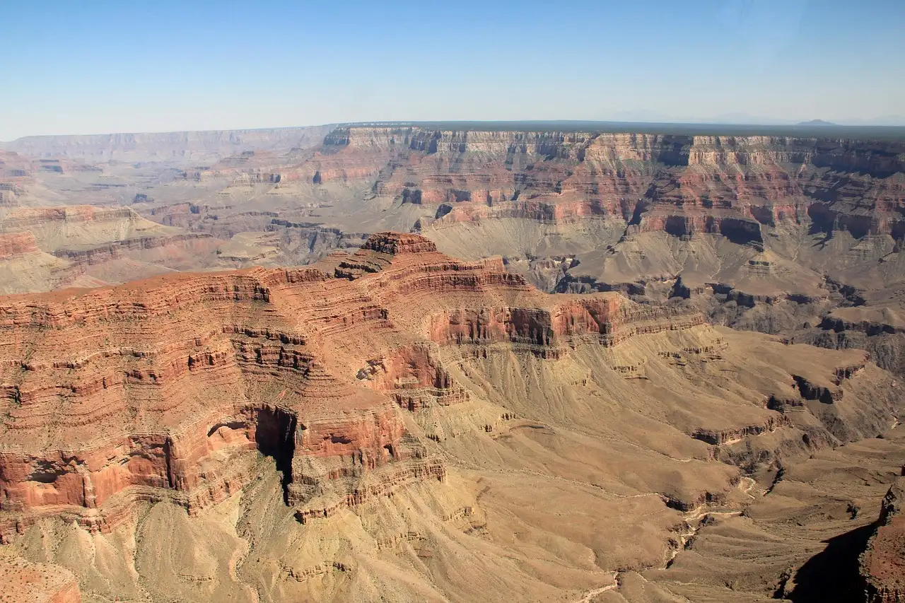 Aerial view over the layered red cliffs of the Grand Canyon on a clear day