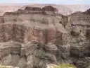 Layered cliffs of the Grand Canyon in brown and red bands at the West Rim