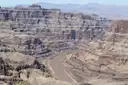 The Colorado River winding between layered cliffs in the Grand Canyon