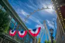 The LINQ Promenade with bunting, the High Roller wheel behind