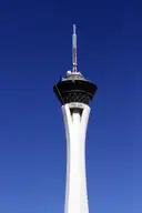 The STRAT tower and the ride mast on top against an evening sky