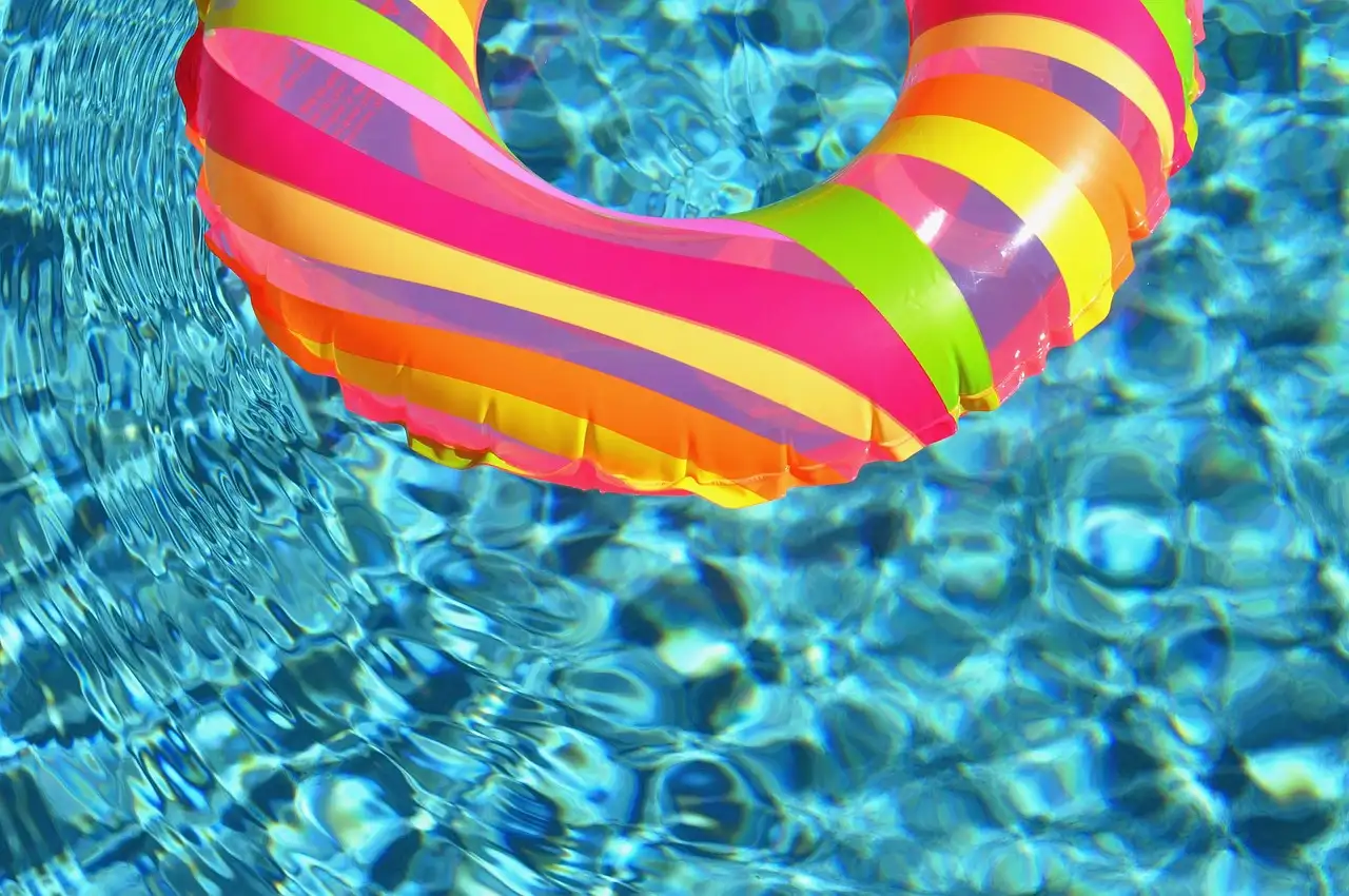 Striped inflatable ring in rippling pool water