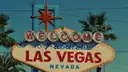 The vintage Welcome to Fabulous Las Vegas sign with its red starburst, framed by palm trees