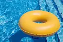 Yellow swim ring floating over pool lane lines