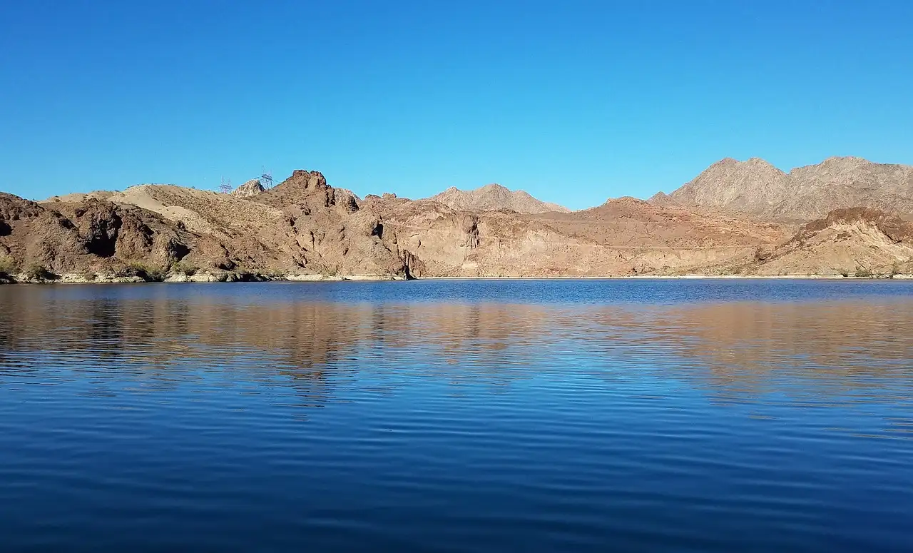 The Colorado River at Willow Beach, calm and blue below bare desert hills